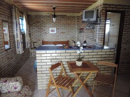 Quarto casal | Área de estar | TV