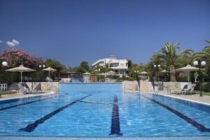 Seasonal outdoor pool, pool umbrellas, pool loungers