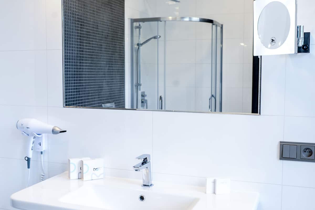 family suite, 1 king bed with sofa bed | bathroom | shower, free toiletries, slippers, towels