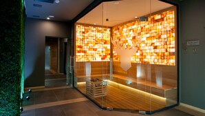 A modern interior with a glass partition, wooden flooring, and a green wall. - Arte Spa & Park Hotel (Velingrad)