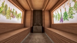 A hallway with wooden paneling, a central sink, and hanging plants on both sides. - Arte Spa & Park Hotel (Velingrad)
