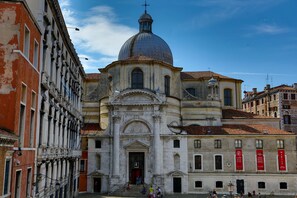 A historic building with a prominent dome and classical architecture. - Albergo Al Gobbo   (Venice)