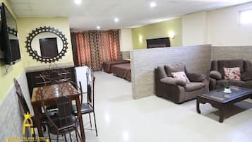 Deluxe Quadruple Room | In-room safe, blackout curtains, soundproofing, iron/ironing board