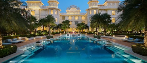 Outdoor pool, open 7 AM to 8 PM, pool umbrellas, pool loungers