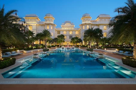 Outdoor pool, open 7 AM to 8 PM, pool umbrellas, pool loungers. The Leela Palace Jaipur