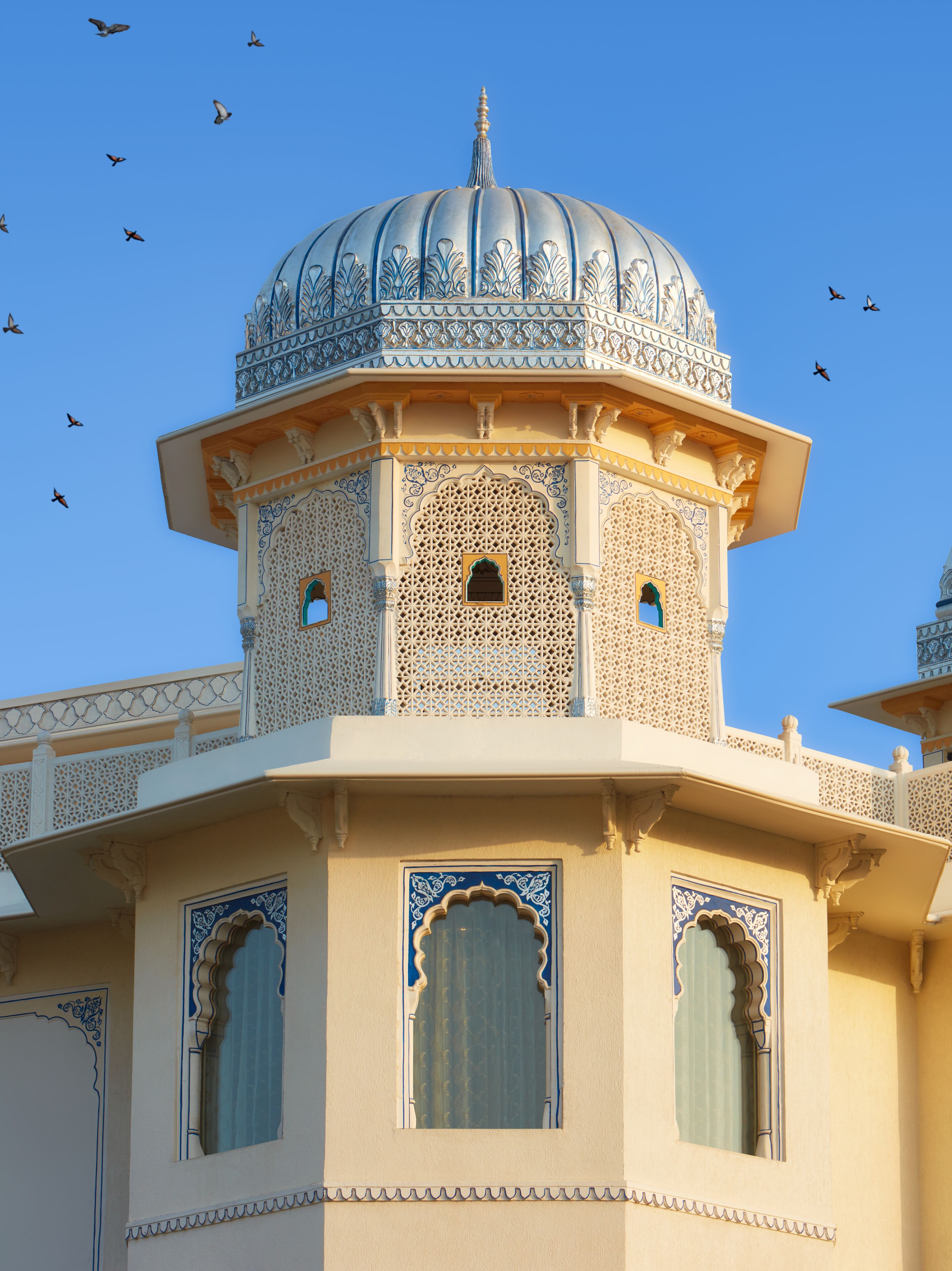 A building with intricate architectural details, including a dome and ornate windows.
