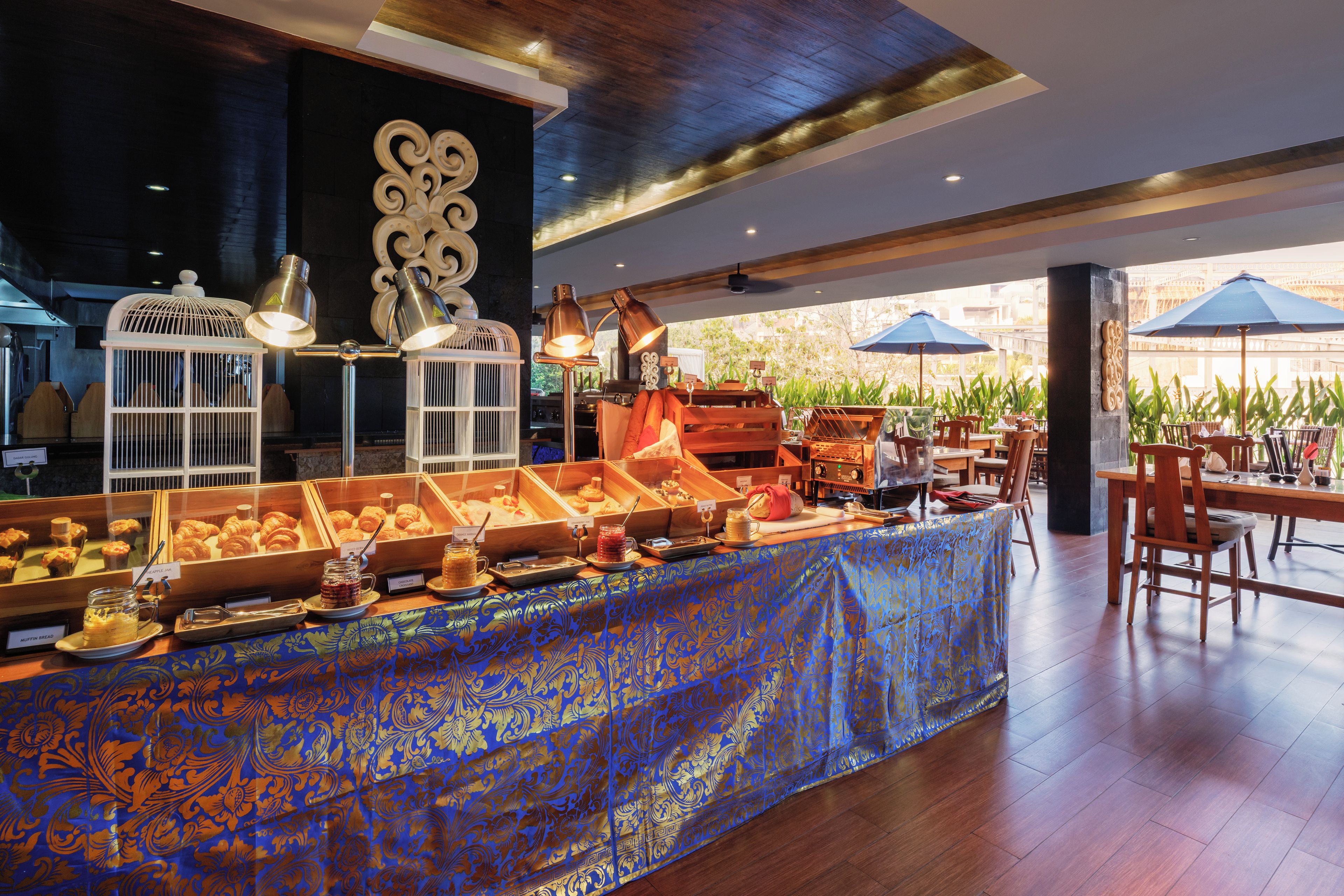 A buffet area with various food items and a coffee station.