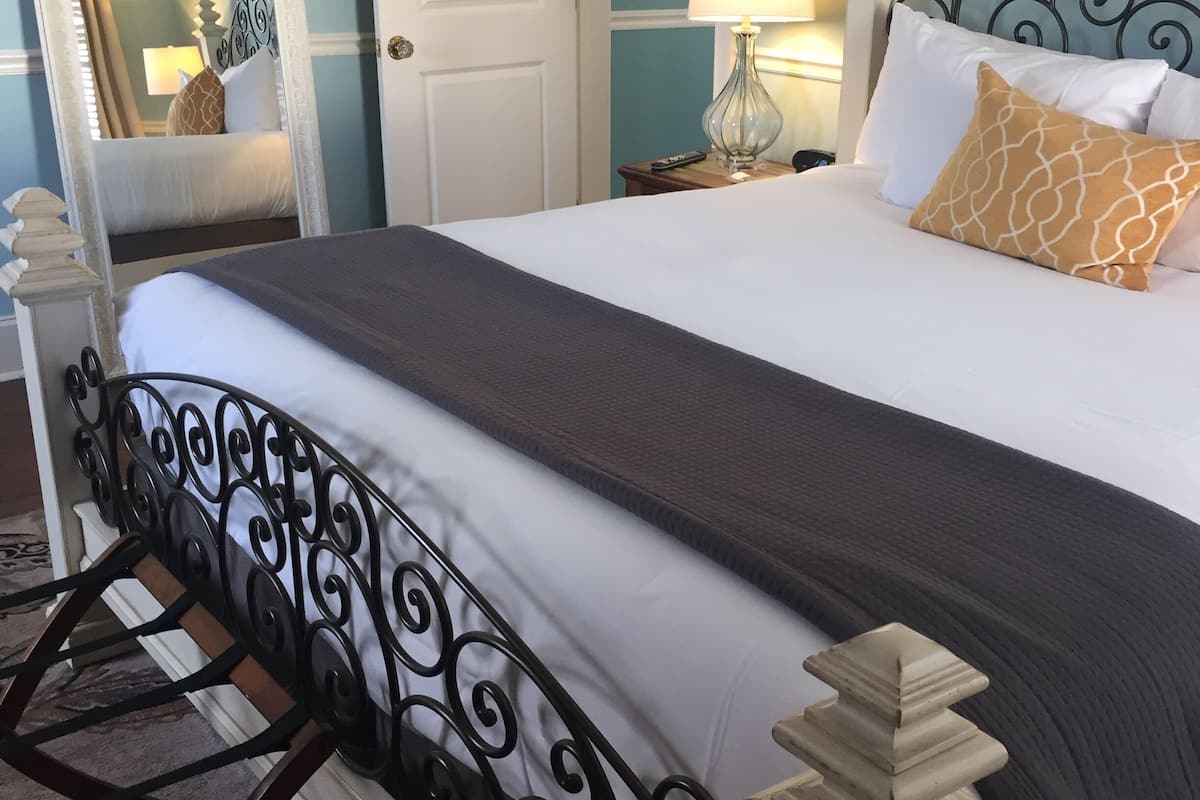 signature room, 1 king bed with sofa bed, non smoking (mcguire suite) | blackout curtains, iron/ironing board, free wifi, bed sheets