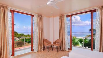 Deluxe Triple Room, 1 Bedroom, Sea View | Minibar, in-room safe, desk, blackout curtains