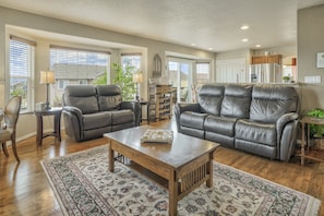 The cozy & modern family room is designed for comfort & connectivity.