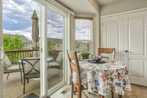 A sliding glass door provides easy access from the kitchen to the spacious deck!