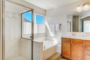 Combined shower/bathtub, hair dryer, towels, soap