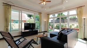 Deluxe Villa, 3 Bedrooms, Pool View, Ground Floor | Living area | 55-inch flat-screen TV with cable channels, Smart TV, Netflix - Hansa Paradise Hill Pool Villa (Pattaya)