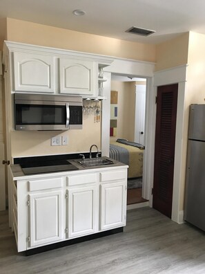 Fridge, microwave, stovetop, coffee/tea maker