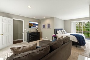 A bedroom with a bed, a TV, a dresser, and a window with a view. - "On the Rocks"  Bourbon Trail Getaway (Taylorsville)