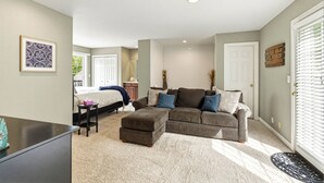 A bedroom with a bed, bedside table, and a dresser. - "On the Rocks"  Bourbon Trail Getaway (Taylorsville)