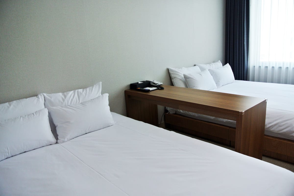 family twin room (deluxe) | 1 bedroom, in-room safe, desk, blackout curtains