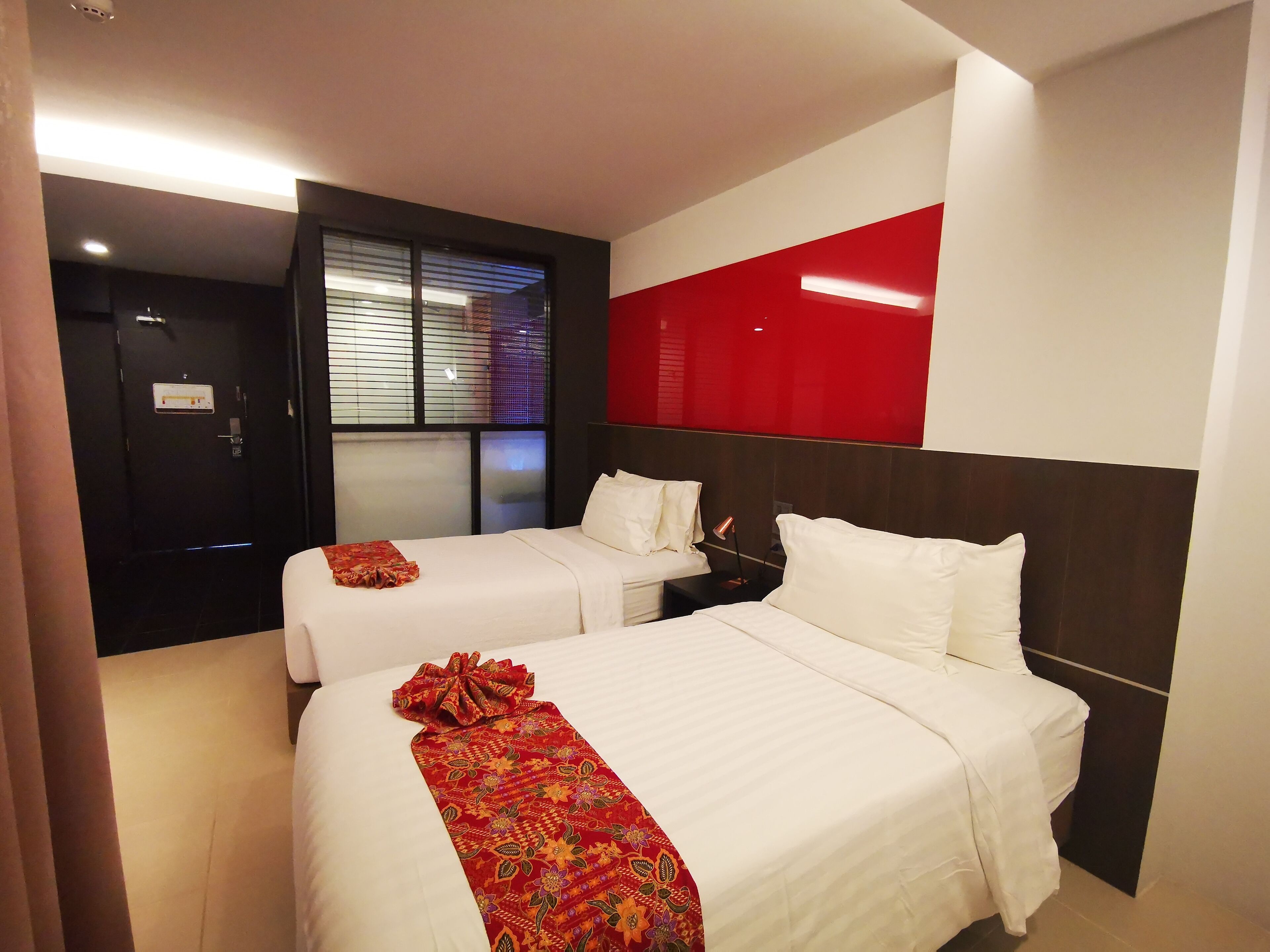 standard twin room | in-room safe, laptop workspace, blackout curtains, iron/ironing board