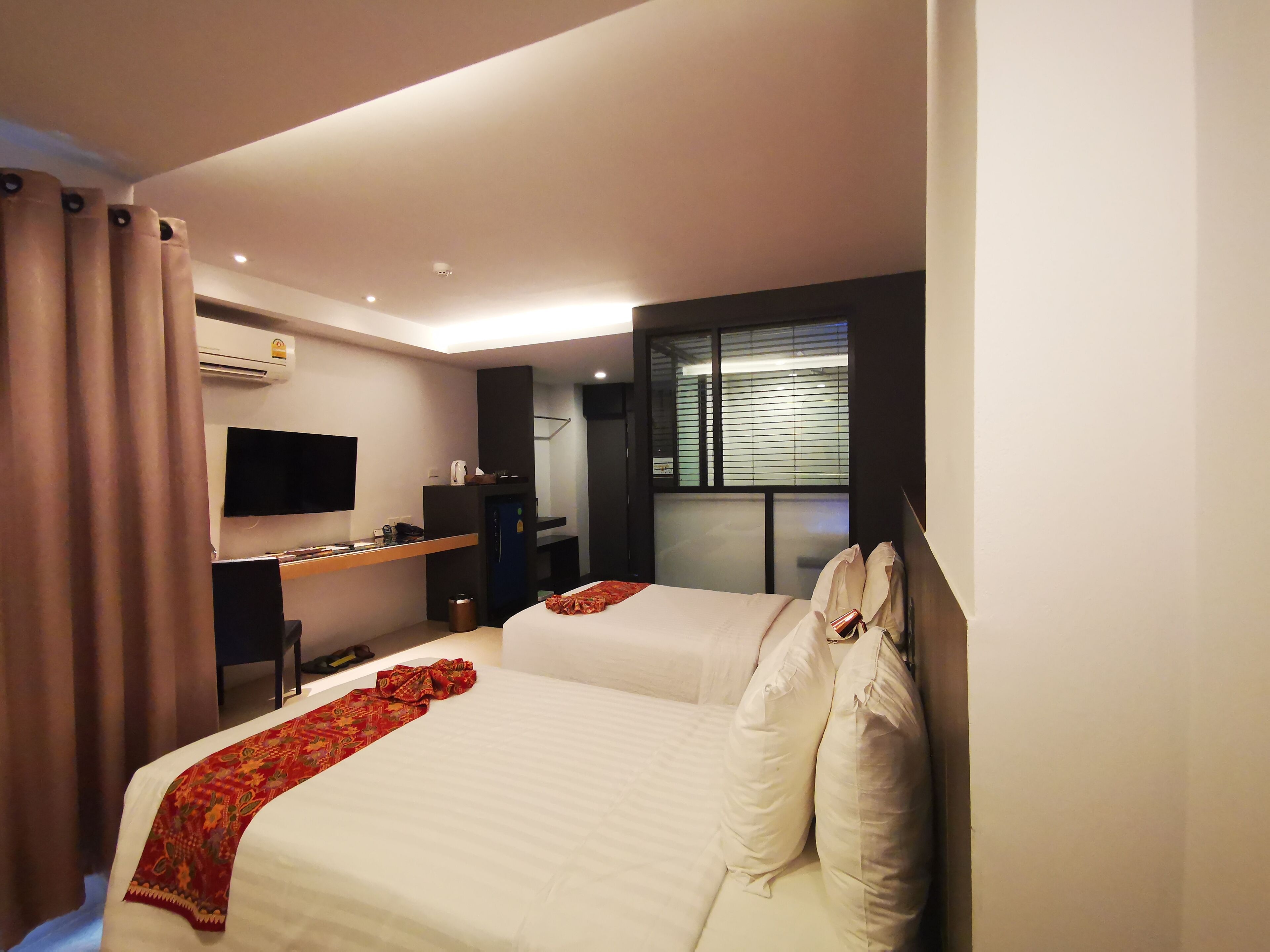 standard twin room | in-room safe, laptop workspace, blackout curtains, iron/ironing board