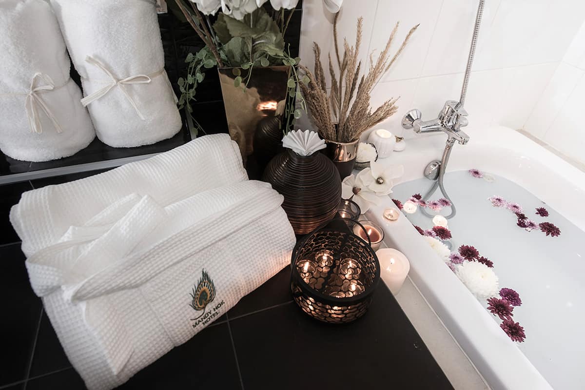 grand suite room | bathroom amenities | shower, designer toiletries, hair dryer, slippers