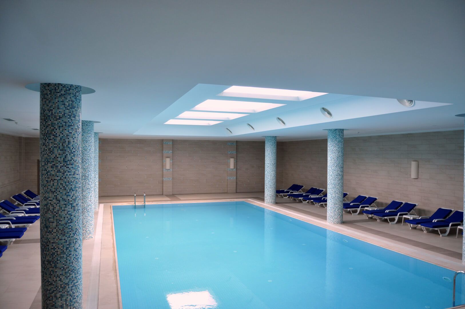 indoor pool, open 8 am to 8 pm, pool loungers