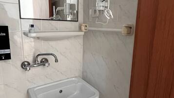 Shower, free toiletries, hair dryer, slippers