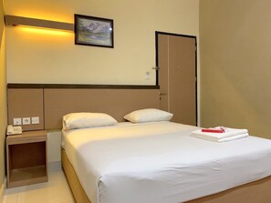 ห้องดีลักซ์ | เครื่องนอนระดับพรีเมียม, เตียงเมมโมรีโฟม, โต๊ะทำงาน, ผ้าม่านกันแสง