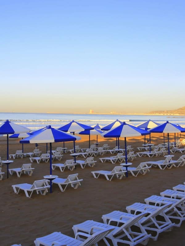 On the beach, sun loungers, beach umbrellas
