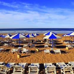 On the beach, sun loungers, beach umbrellas