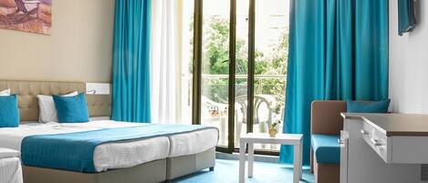 Minibar, desk, blackout drapes, iron/ironing board