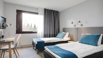 Twin Room | Desk, laptop workspace, blackout drapes, iron/ironing board