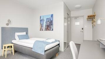 Desk, laptop workspace, blackout drapes, iron/ironing board