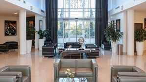 A spacious lobby with a central seating area, large windows, and modern decor. - Westotel Le Pouliguen (Le Pouliguen)