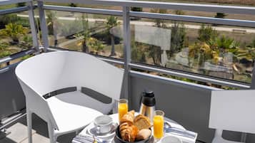 Enjoy a leisurely breakfast on the balcony with a view of the surrounding landscape.