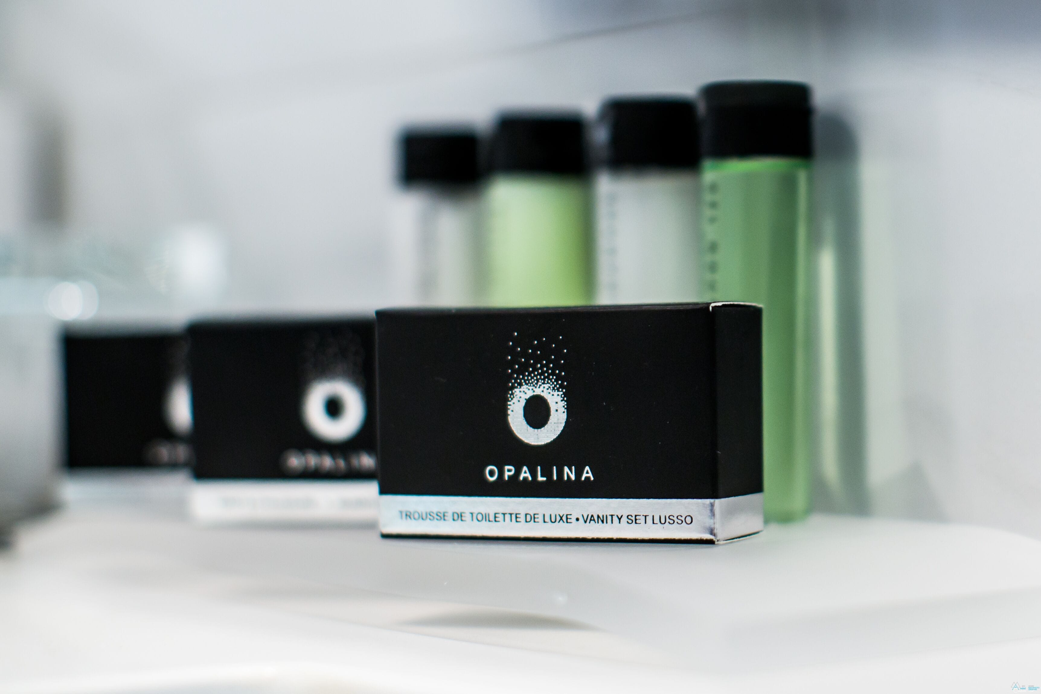 designer toiletries, hair dryer, bathrobes, slippers