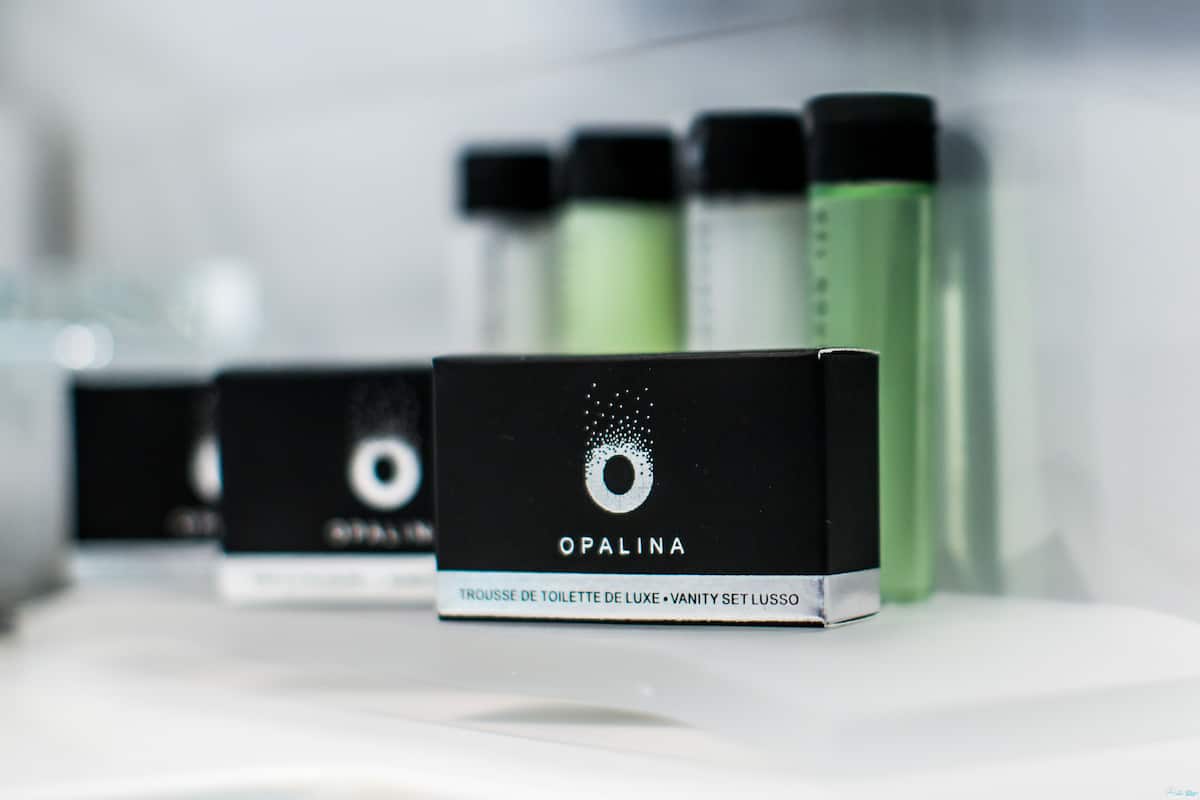 designer toiletries, hair dryer, bathrobes, slippers