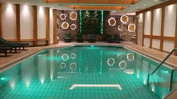 Indoor pool, open 8:00 AM to 10:00 PM, pool loungers