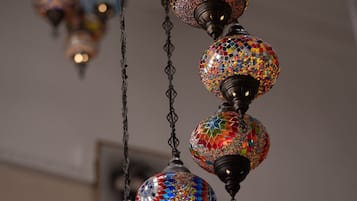 A series of hanging decorative lamps with mosaic patterns.
