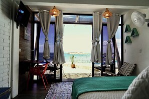 Chambre triple Deluxe | Vue sur la plage ou l’océan