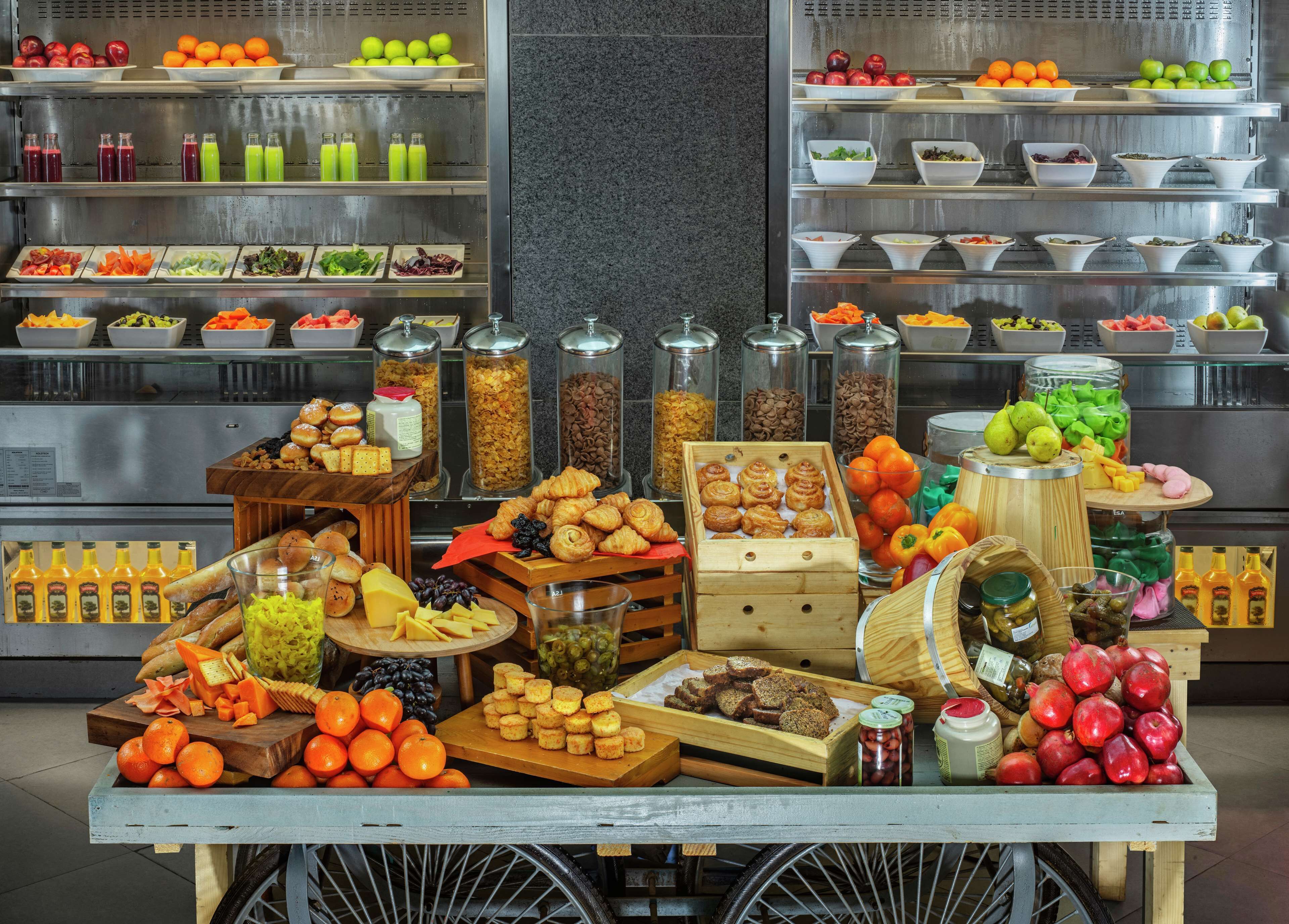 A buffet with various food items and beverages.