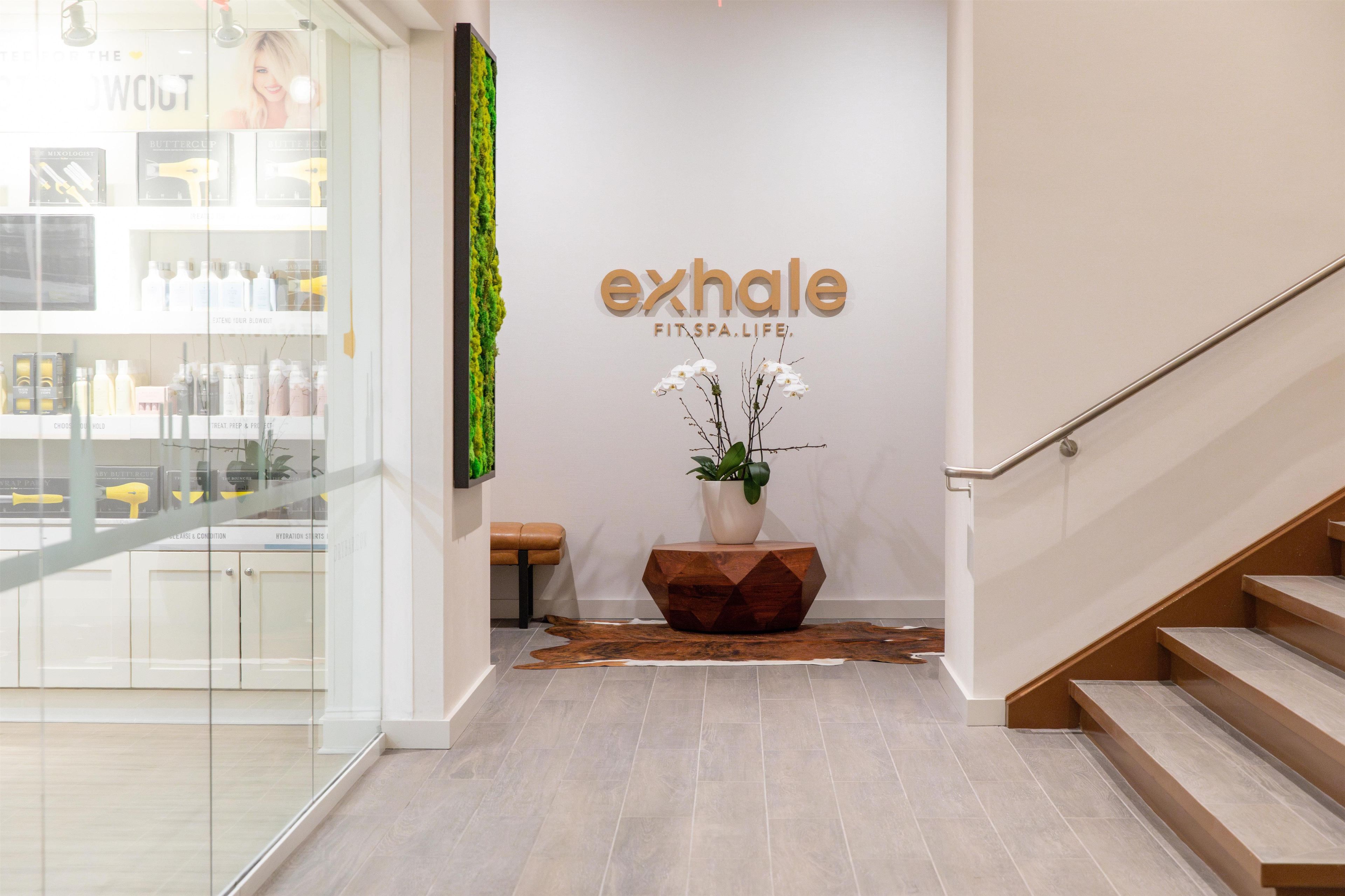 A spa entrance with a sign reading 'exhale FIT SPA LIFE.'