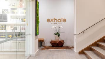 A spa entrance with a sign reading 'exhale FIT SPA LIFE.'