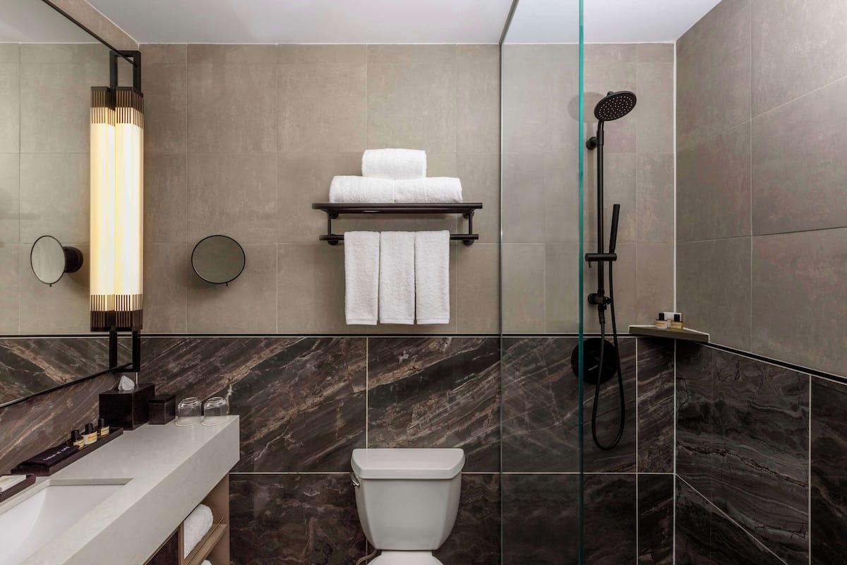 Designer toiletries, hair dryer, bathrobes, towels