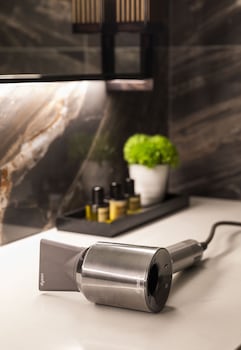 Designer toiletries, hair dryer, bathrobes, towels at Thompson Central Park New York, by Hyatt