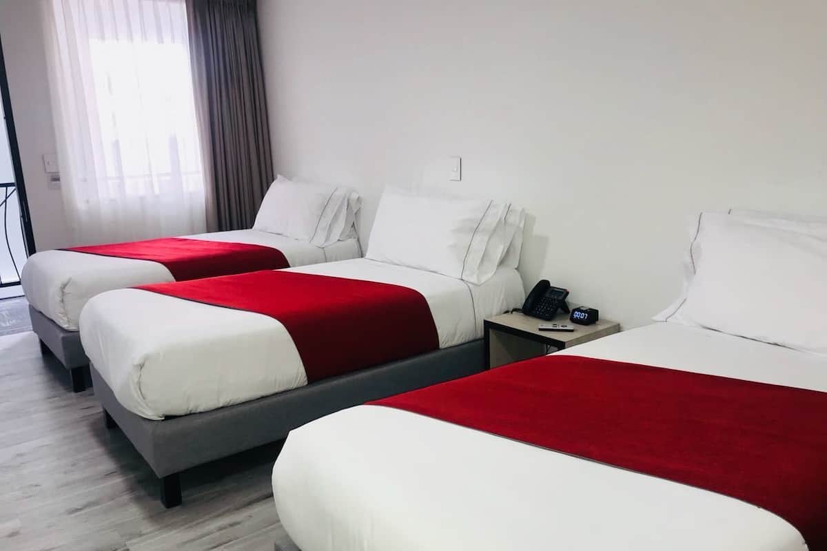Triple Room | Minibar, in-room safe, blackout drapes, iron/ironing board