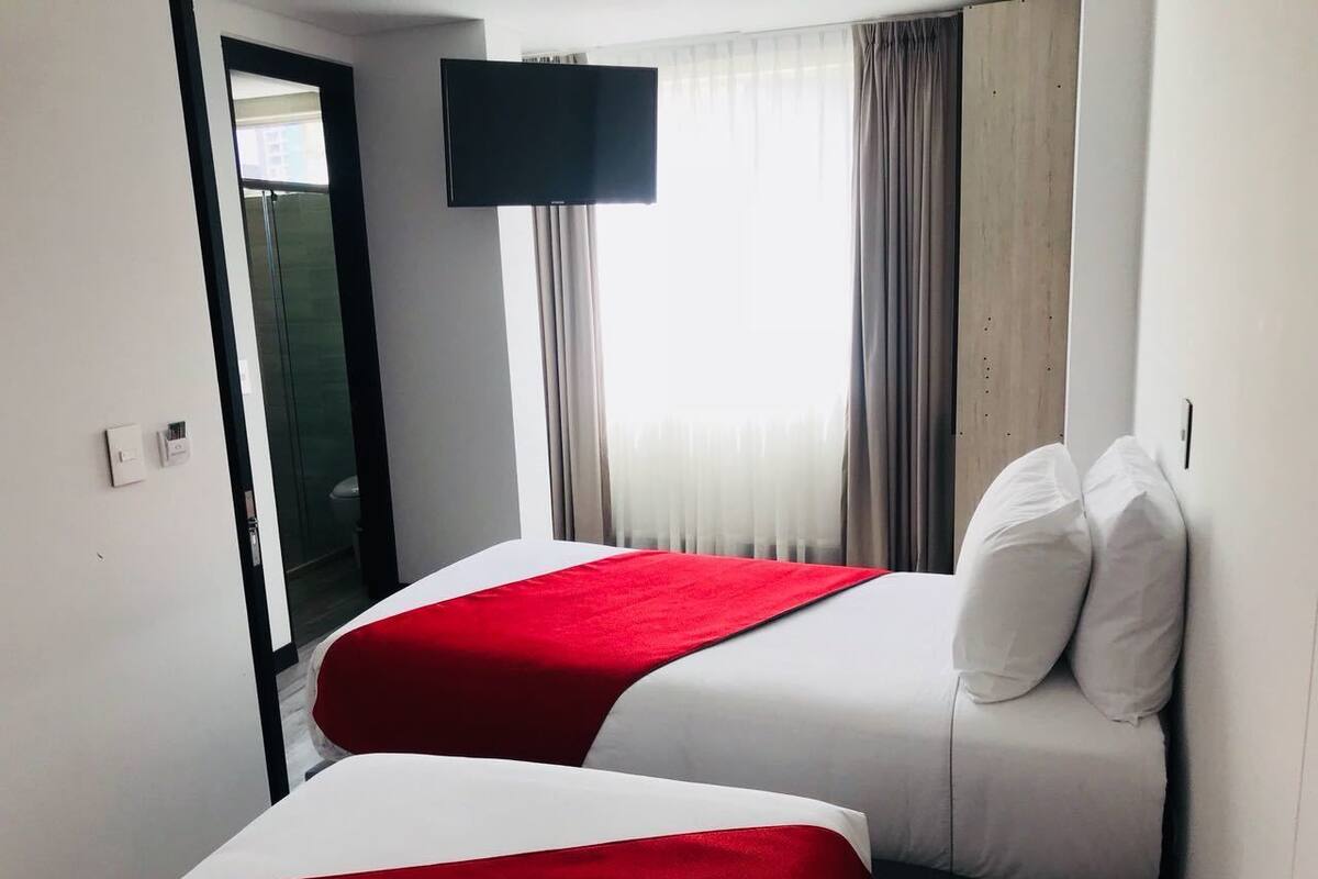 Twin Room | Minibar, in-room safe, blackout drapes, iron/ironing board (on request)