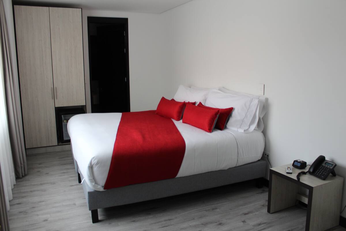 Double Room | Minibar, in-room safe, blackout drapes, iron/ironing board (on request)