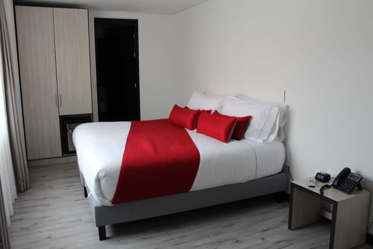 Double Room | Minibar, in-room safe, blackout drapes, iron/ironing board