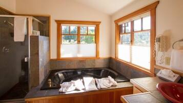 Luxury Suite, 1 King Bed | Bathroom | Separate bathtub and shower, jetted bath, hair dryer, bathrobes