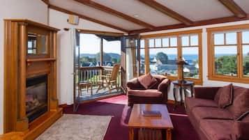 Luxury Suite, 1 King Bed | Living room | Flat-screen TV, fireplace